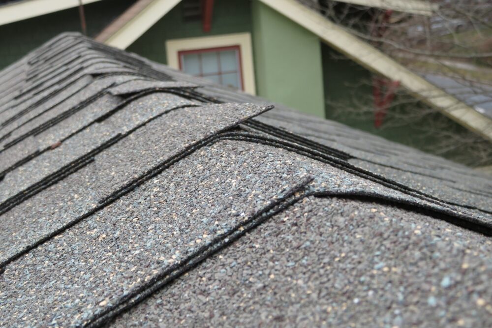 Improper-shingles-are-used-at-this-roof-ridge-notice-how-the-edges-are-stick-up