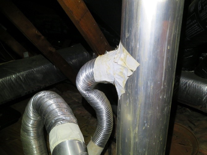 Interesting installation for GAS water heater vent. Joints are taped with improper material and the vent pipe should always RISE minimum of ¼” per foot, NOT, downhill! 