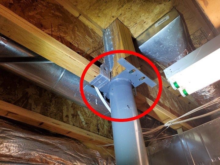 Structural post is NOT secured to a main level post 