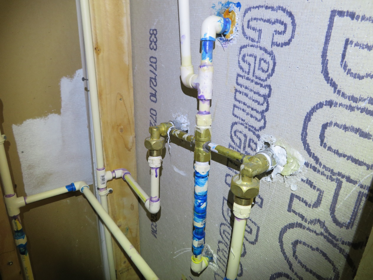 “Flip” house plumber to install wall support for the plastic water supply lines at the
