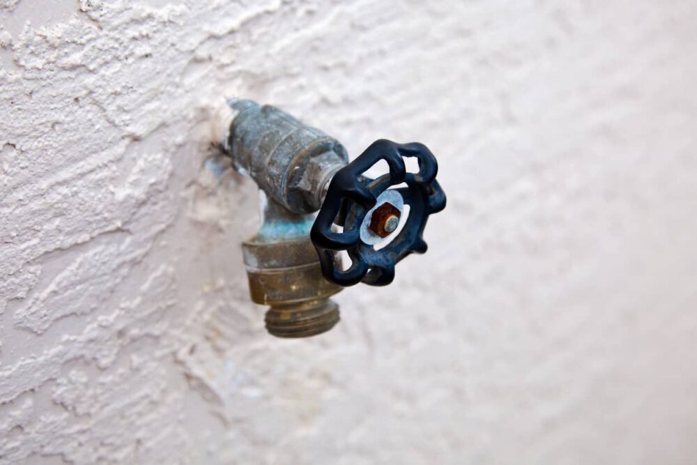 Outdoor spigot that has a backflow preventer. 