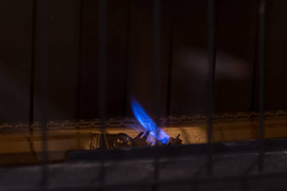 Blue pilot light on a furnace. 