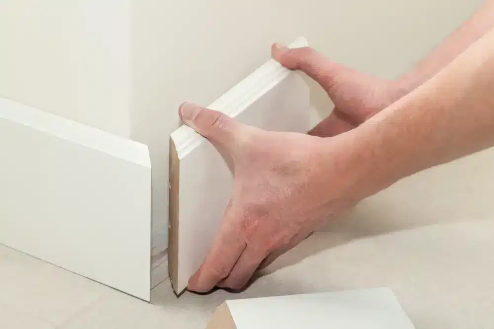 Sometimes you need to cut the baseboard on a corner to make it fit. 