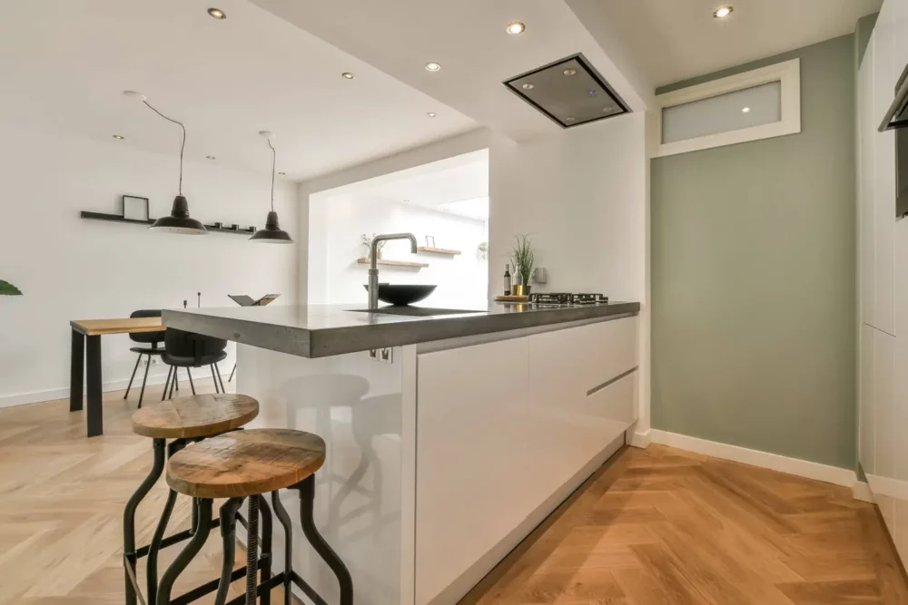 Kitchen with recessed lighting and evenly spaced due to lower ceilings. 