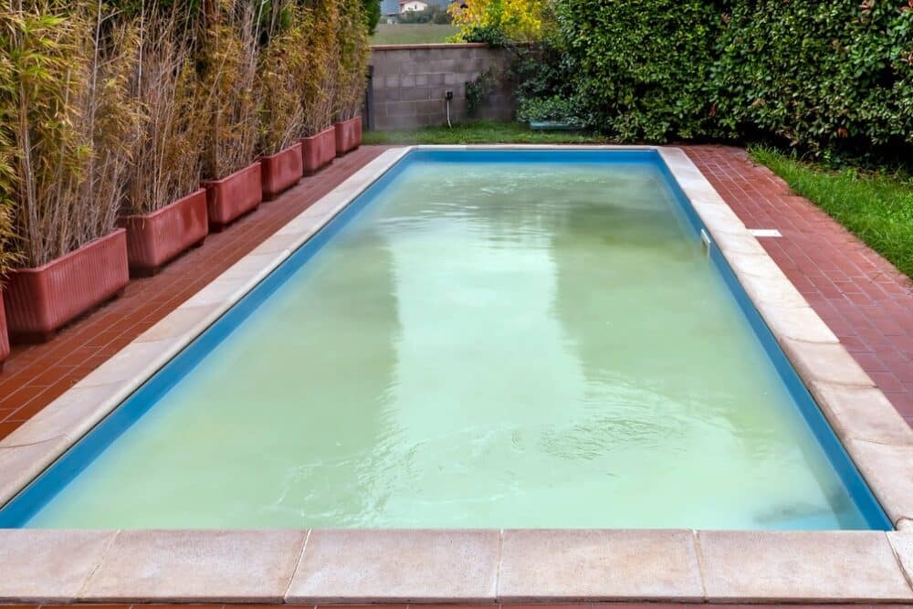 A pool that has been shocked and trying to clean up the algae. One must wait 24 hours before going in to swim in order to avoid rashes and respiratory issues. 