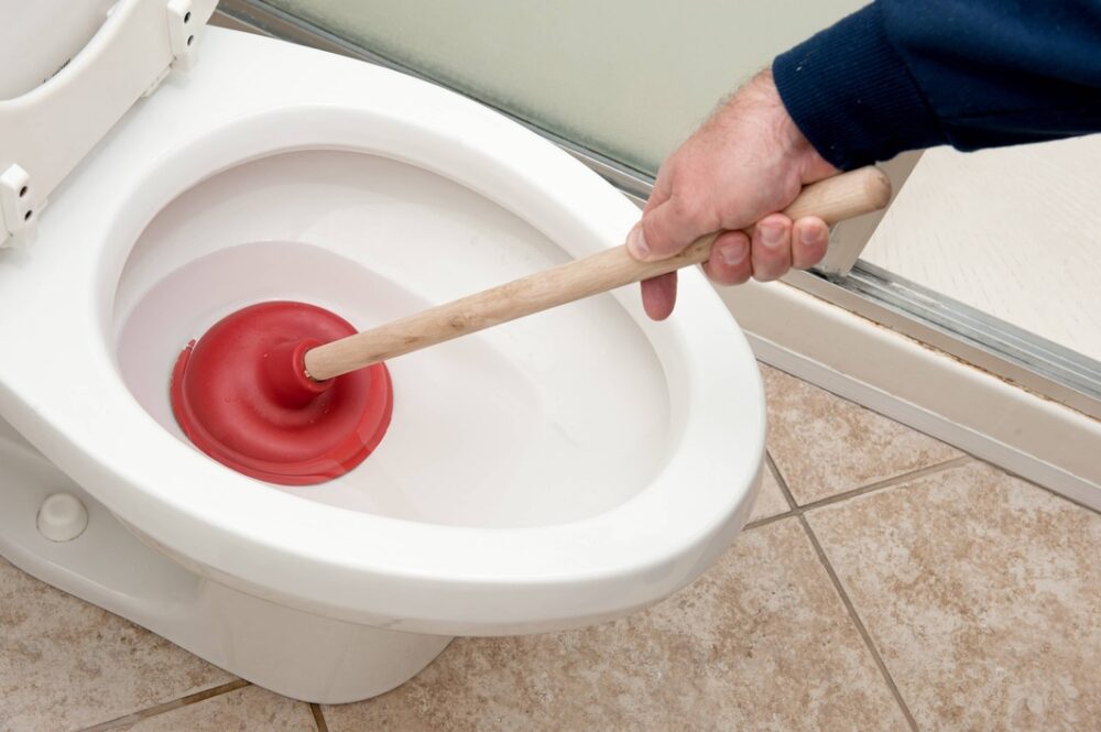 Holding the plunger at a specific angle is important in order to unclog it. 
